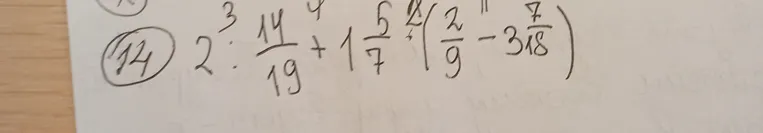 Вычислить значение выражения $2\frac{3}{4} : \frac{14}{19} + 1\frac{5}{7} \left(\frac{2}{9} - 3\frac{7}{18}\right)$