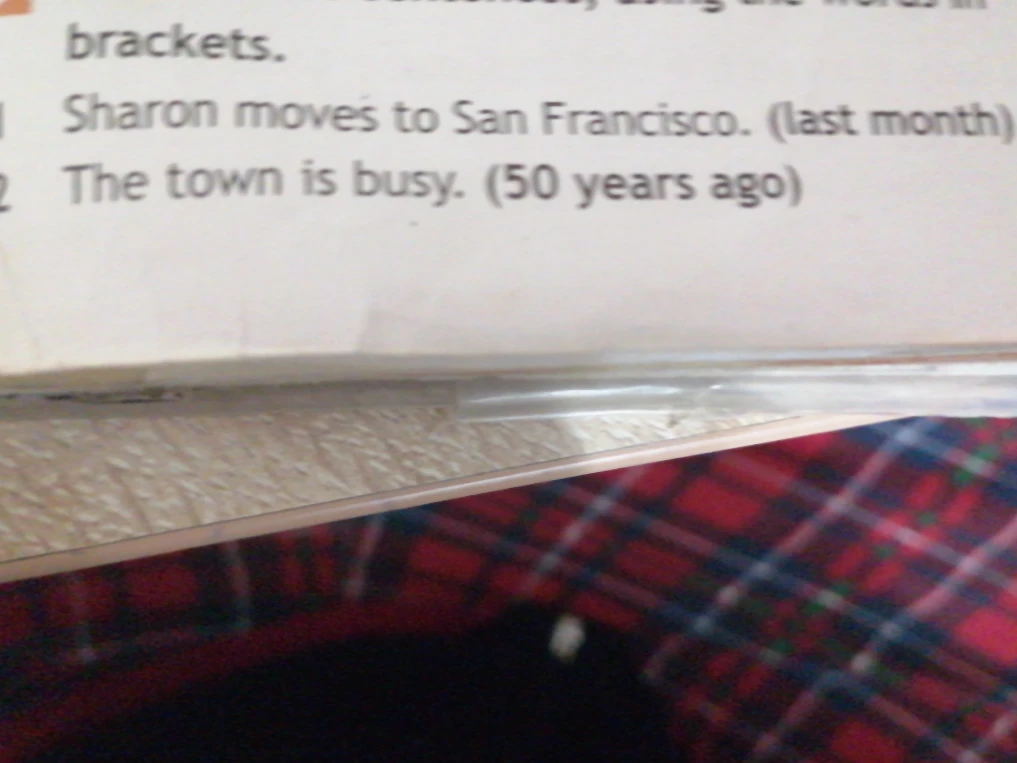 Sharon moves to San Francisco. (last month) The town is busy. (50 years ago)