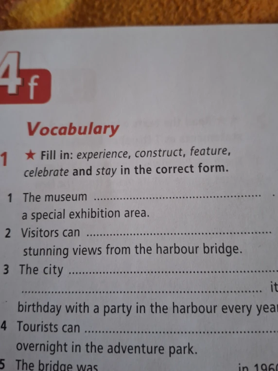 Fill in: experience, construct, feature, celebrate and stay in the correct form.