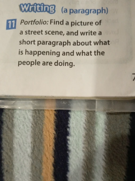 Portfolio: Find a picture of a street scene, and write a short paragraph about what is happening and what the people are doing.