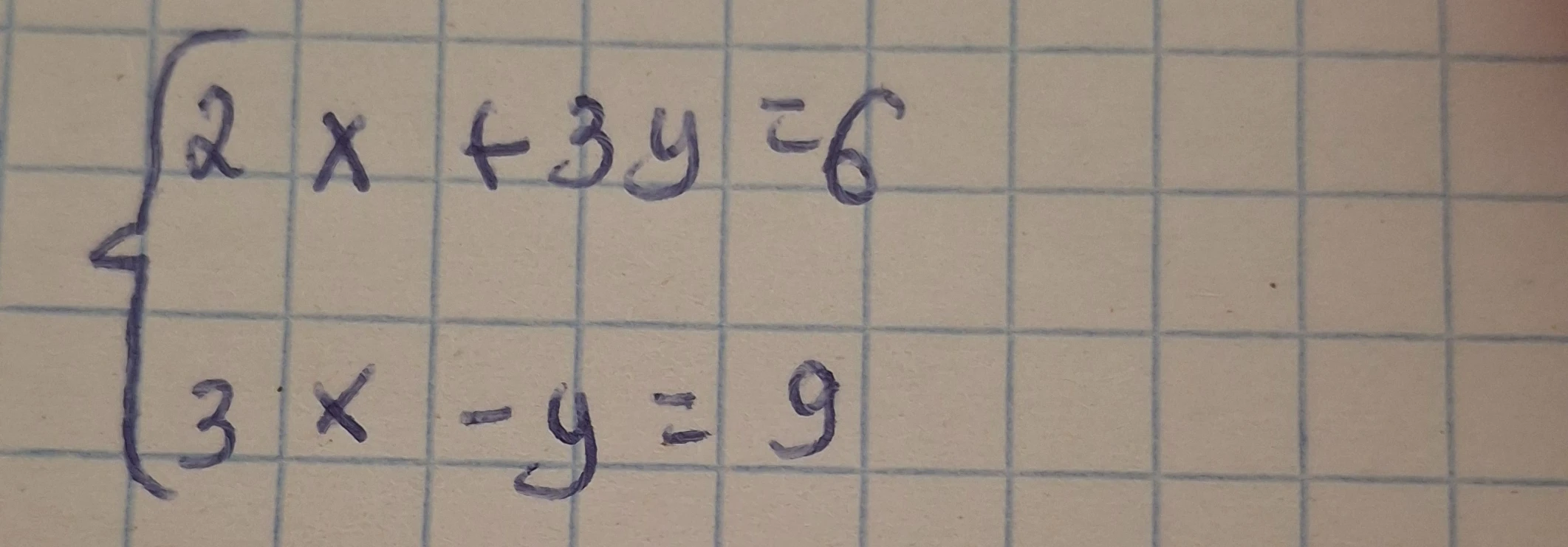 Решите систему уравнений { 2x + 3y = 6; 3x - y = 9