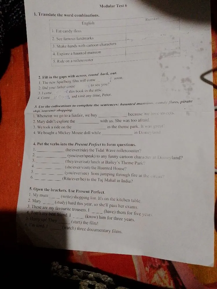 Modular Test 6. Translate the word combinations: 1. Eat candy floss; 2. See famous landmarks; 3. Shake hands with cartoon characters; 4. Explore a haunted mansion; 5. Ride on a rollercoaster.