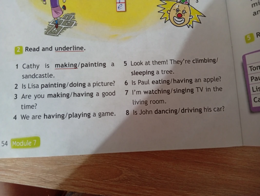 2 Read and underline. 1 Cathy is making/painting a sandcastle.