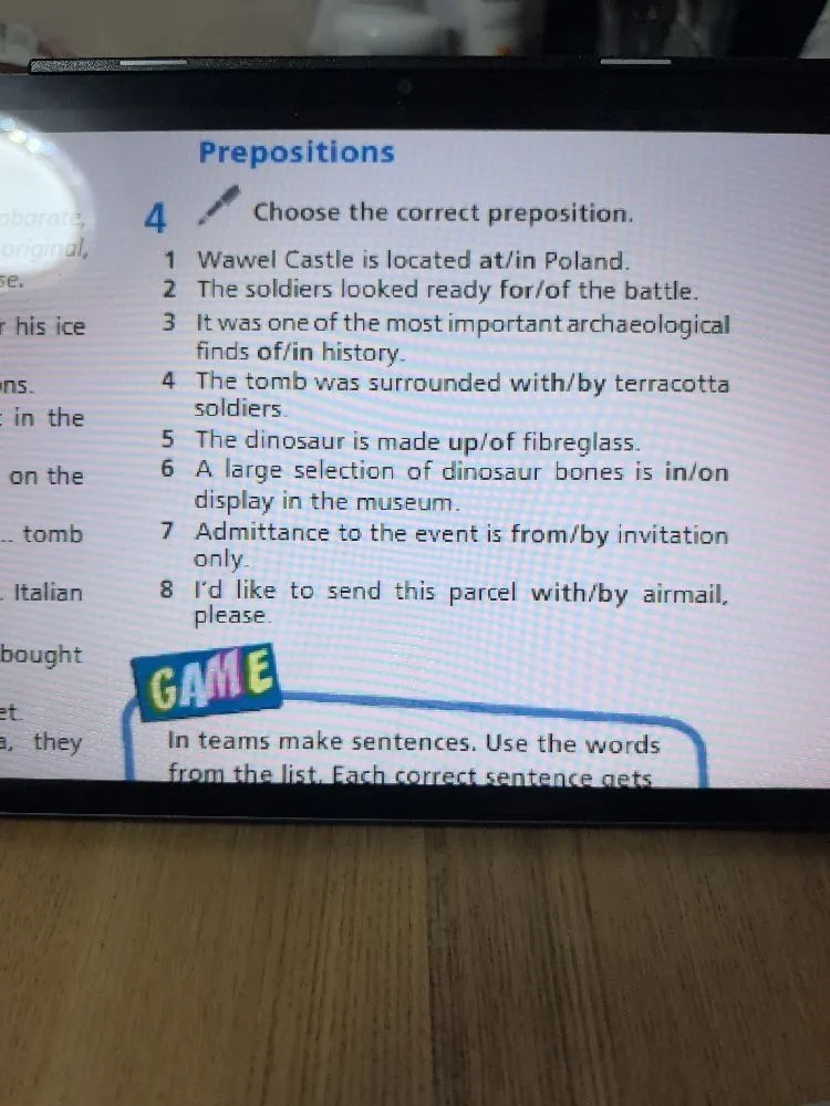 Choose the correct preposition.