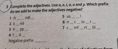 Complete the adjectives. Use a, e, i, o, u and y. Which prefix do we add to make the adjectives negative?