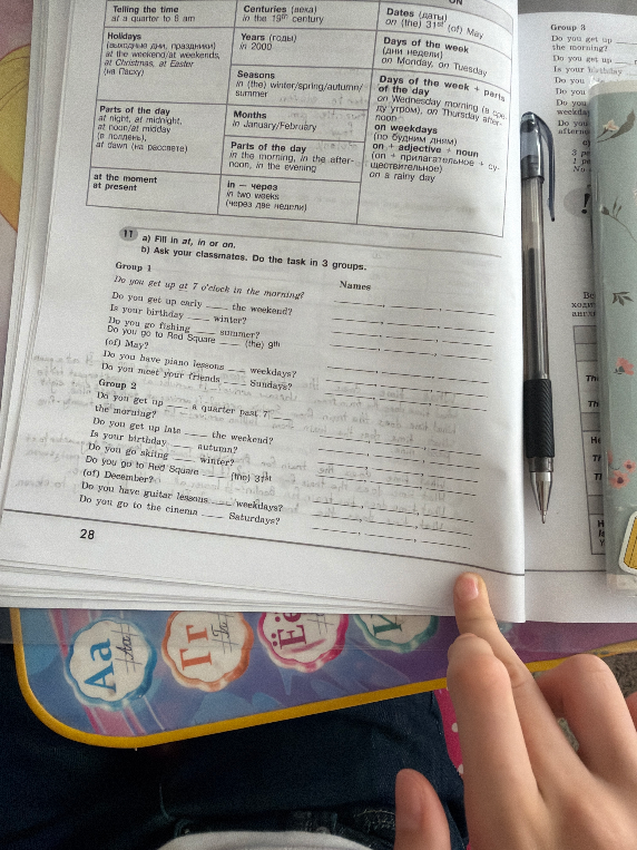 11 a) Fill in at, in or on.