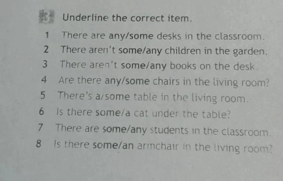 Underline the correct item. There are any/some desks in the classroom.